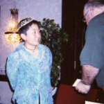 Hiromi Goto, wearing the tiara, receives her award.